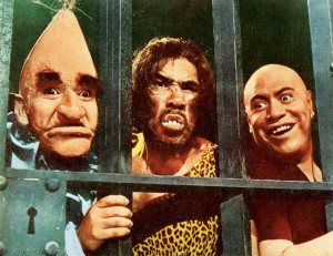 Carrot Head (left) and Siamese twins Dogface and friend relish their roles as jailkeepers at the castle of the Queen of Badness.