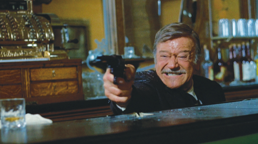 The final shootout — an old-guy fantasy. Marion Morrison died in a hospital bed, but John Wayne died in a blaze of glory.